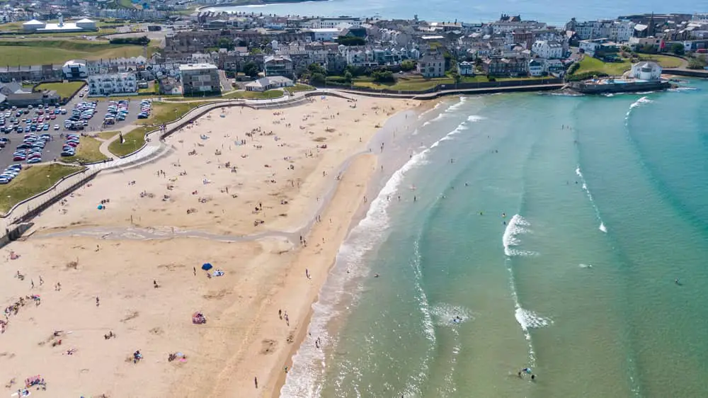 East Strand Portrush from the air on a sunny day with Portrush Town in the background