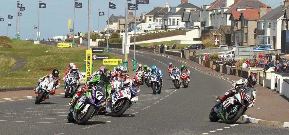 Riders coming down the coast road to mILL ROAD CORNER ON THE NORTH WEST 200