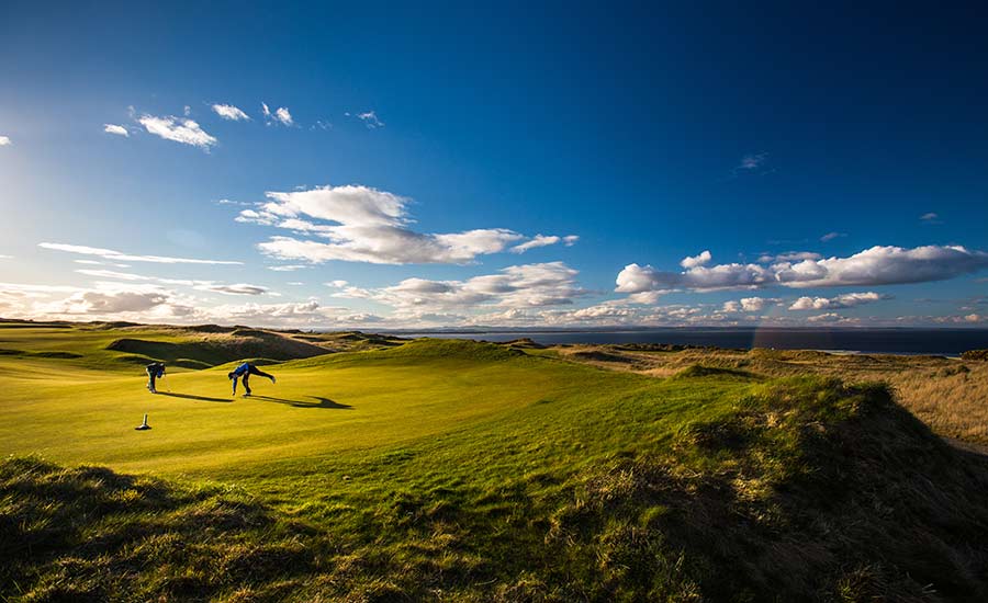 Golfers playing on a links golf course
